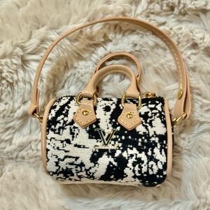 Elegant Black and White Handbag with Gold accent